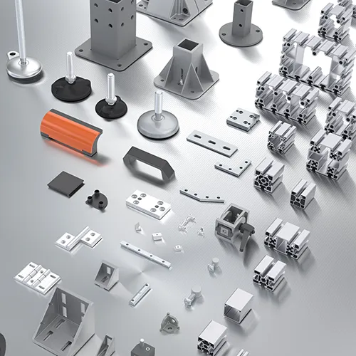 A spread of profiles and accessories compatible with the BH slot. Visible are aluminum profiles of various sizes and shapes, along with accessories such as anchoring bases, swivel feet, handles, and joints.